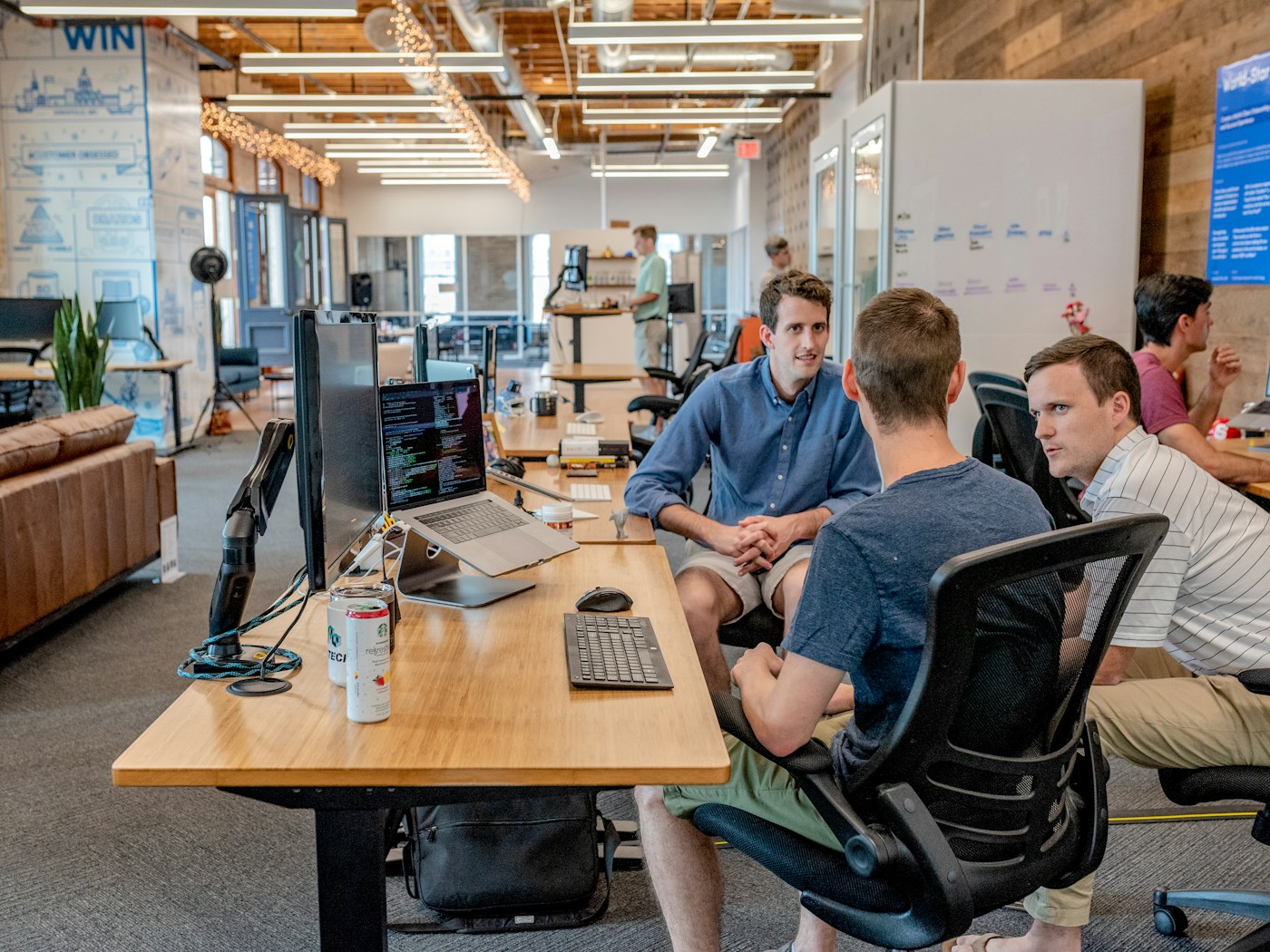 Professionals collaborating around a table during a strategic business discussion