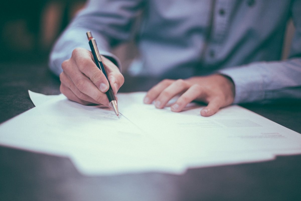 Professional reviewing a signed business document